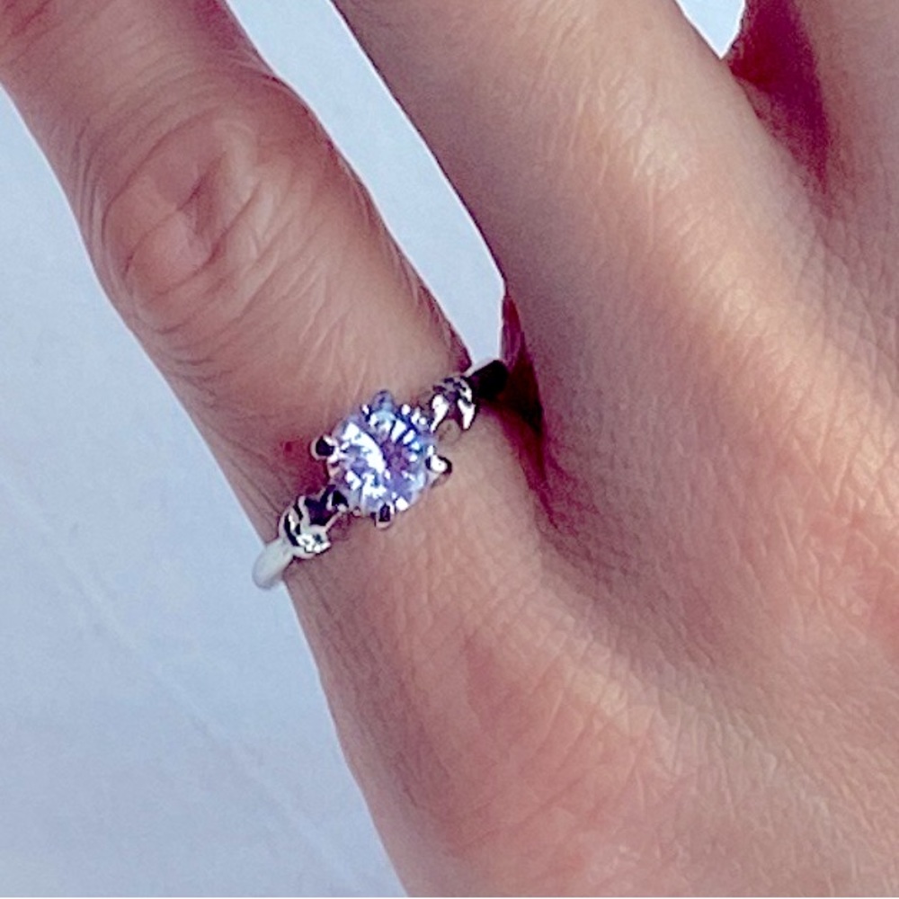 Pale pink solitaire pinky ring